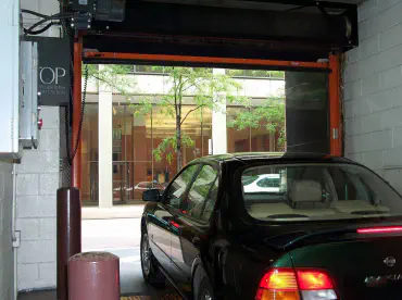 Car leaving a parking garage