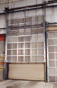 an overhead glass garage door partially open