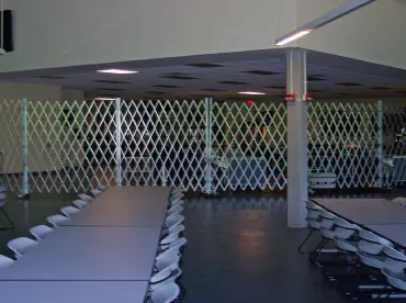 portable scissor gates installed in a cafeteria