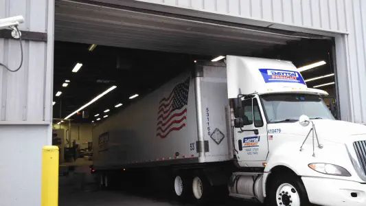 semi-truck leaving garage